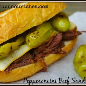Pepperoncini Beef Sandwiches -- Flavor-packed sandwiches with beef that falls apart flavored with tangy pepperoncini peppers and smothered with cheese. | thatwhichnourishes.com