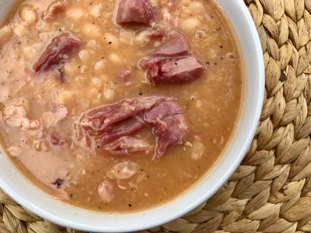 Hearty Bean and Ham Soup -- A thick and hearty soup made with a leftover ham bone and white beans. A few ingredients dropped in a pot turns into a rich, savory, nourishing dinner. | thatwhichnourishes.com