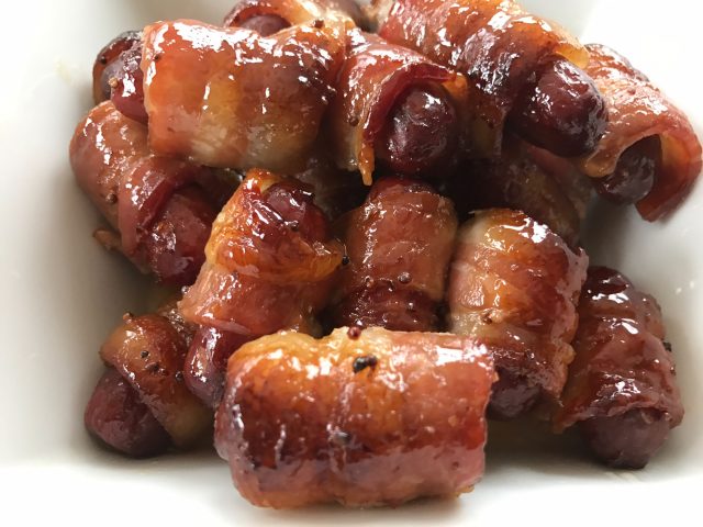 Maple Glazed Bacon Weenies -- Little smokes turn into little bites of drool-worthy yum when they are wrapped in a bacon and caramelized in a sweet and savory maple mustard glaze | thatwhichnourishes.com