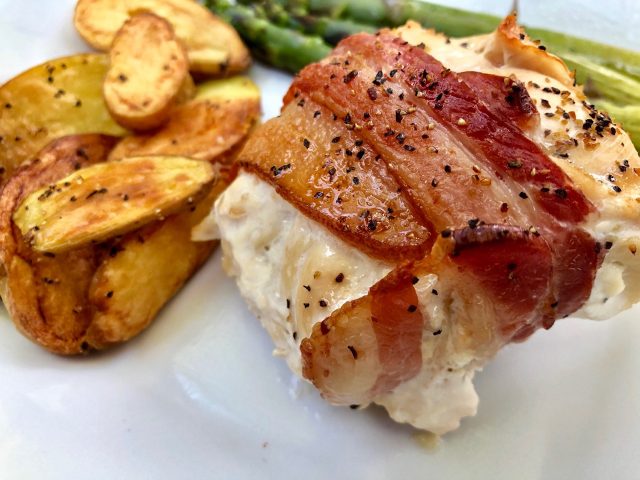 Bacon Wrapped Stuffed Chicken Breasts -- Flavored cream cheese fills a tender chicken breast wrapped in crispy bacon. A simple recipe that is elegant and delicious. | thatwhichnourishes.com