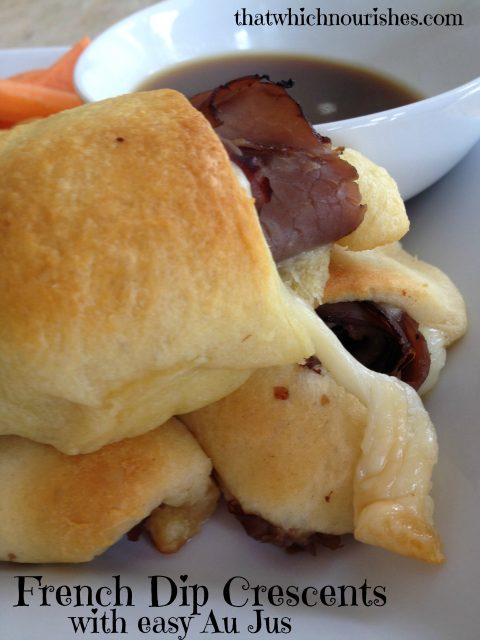 French Dip Crescents with easy Au Jus -- Easy, peasy and they taste like gooey deliciousness that can be made in no time. Deli roast beef, crescent rolls, and cheese make an impressive lunch if you need to impress, but also a quick, weeknight dinner. | thatwhichnourishes.com