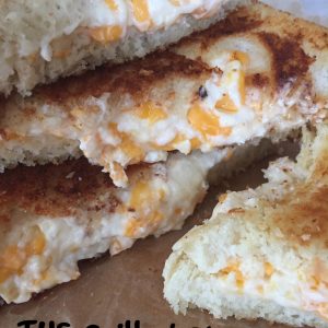THE Grilled Cheese -- You'll just never eat one this good, I pretty much promise. Loaded with fresh garlic and a cheesy filling that's just too good to be true, I guarantee true love at first bite. | thatwhichnourishes.com