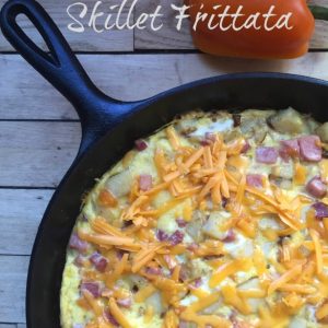Skillet Frittata -- perfectly packed with flavorful veggies, savory meat, and surrounded by fluffy eggs and sprinkled with cheese. Prepared in a cast iron skillet, and ready in less than 20 minutes! | thatwhichnourishes.com