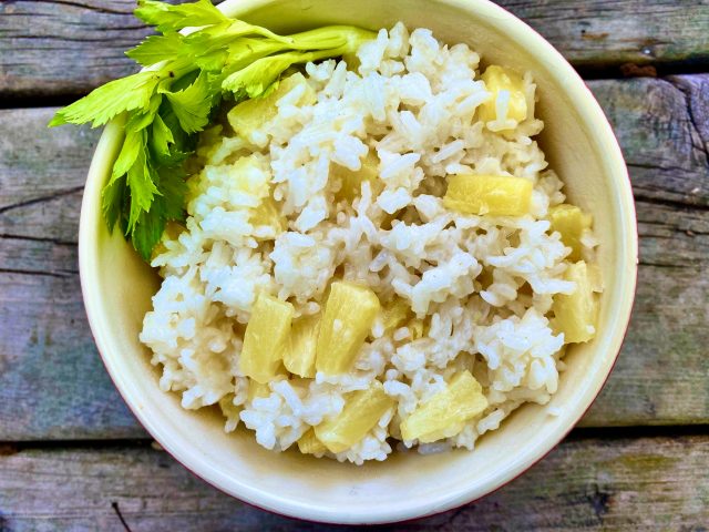 Pineapple Coconut Rice -- Creamy, coconut-y rice with hints of sweetness from pineapple. This easy rice makes a perfect and unique side dish ideal with chicken, fish, or pork. | thatwhichnourishes.com