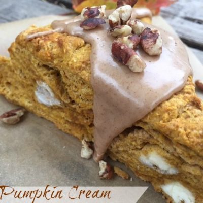 Pumpkin Cream Cheese Scones -- Pumpkin Cream Cheese Scones with maple cinnamon glaze take pumpkin scones to a whole new level with creamy cheese and a gooey glaze made with maple syrup. | thatwhichnourishes.com