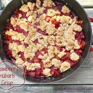 Strawberry Rhubarb Crisp -- Strawberries and rhubarb get married and make a delicious combination of sweet and tart under a crispy blanket of buttery oats and brown sugar. | thatwhichnourishes.com