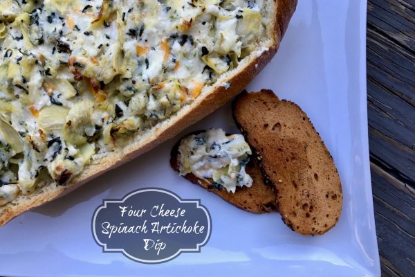 Four Spinach Artichoke Dip == Four cheeses combine perfectly with garlic, spinach, and artichokes to create the very best version of this classic dip we all love. Bake it in a bread bowl for ultimate dipping pleasure. | thatwhichnourishes.com