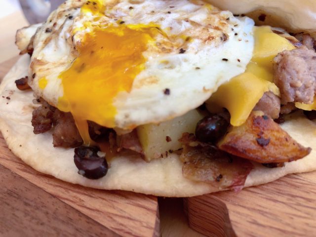 Best Breakfast Burritos -- Savory sausage, crispy potatoes, melty cheese, and a fried egg on top -- these Best Breakfast Burritos have all the elements you crave in one delightful package. | thatwhichnourishes.com