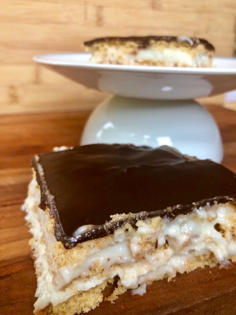 Classic Eclair Dessert -- Layers of vanilla pudding folded into homemade, sweetened whipped cream, and graham crackers topped with blanket of homemade, silky-rich, chocolate ganache.  This is dessert heaven! | thatwhichnourishes.com