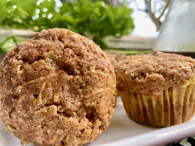 Autumn Spiced Cheesecake Muffins -- Soft, moist muffins spiced with all the warm, Autumn spices and layered with stripe of cheesecake-goodness.  Filled with zucchini, carrots, coconut oil, and maple syrup, these beauties are as nourishing as they are delicious! | thatwhichnourishes.com