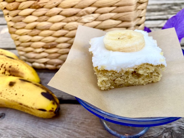 Tami's Frosted Banana Bars -- Soft and moist banana cake frosted with a simple yet decadent vanilla frosting. I dare you to try and eat just one! | thatwhichnourishes.com