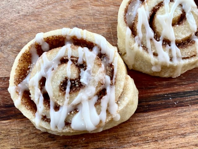 A perfect sugar cookie spiraled around butter and cinnamon sugar and drizzled with a decadent maple glaze. | thatwhichnourishes.com