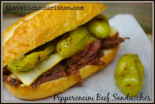 Pepperoncini Beef Sandwiches -- Flavor-packed sandwiches with beef that falls apart flavored with tangy pepperoncini peppers and smothered with cheese. | thatwhichnourishes.com