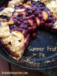 Summer Fruit Pie -- Edible gold in the form of all the juicy summer fruits fill a gorgeous, rustic crust made in a cast iron skillet. Bubbling hot filling in a crunchy almond crust make a pie you'll absolutely drool over. | thatwhichnourishes.com
