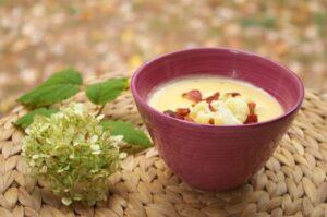 Cheese Soup with Roasted Cauliflower and Bacon -- Smooth, creamy and savory, this cheese soup is made unique by adding roasted cauliflower with a secret ingredient and garnished with bacon. | thatwhichnourishes.com