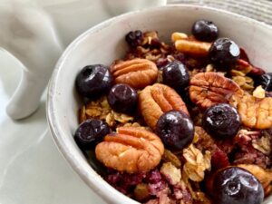 Hearty Baked Oatmeal -- This oatmeal is baked with fruit, nuts, cinnamon and spice and everything nice. It's like an oatmeal cookie in a bowl! | thatwhichnourishes.com