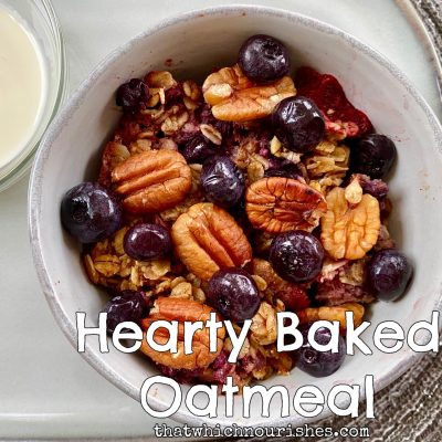 Hearty Baked Oatmeal -- This oatmeal is baked with fruit, nuts, cinnamon and spice and everything nice. It's like an oatmeal cookie in a bowl! | thatwhichnourishes.com