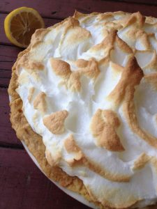 Classic Lemon Meringue Pie -- The perfect slice of lemon pie. Bright, lemony custard baked under a fluffy meringue sure to knock socks off. | thatwhichnourishes.com