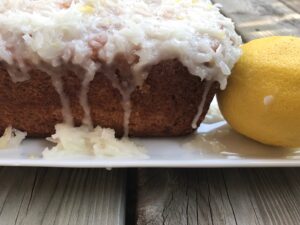 Lemon Zucchini Bread with Lemon Coconut Glaze -- Impossibly soft lemon bread blanketed with a tart, lemony-coconut glaze. Here's an easy and delicious way to use up that garden zucchini! | thatwhichnourishes.com