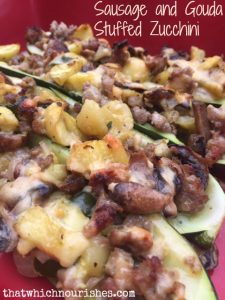Sausage and Gouda Stuffed Zucchini -- This is the way to turn your veggies into a savory dish studded with sausage and savory gouda. | thatwhichnourishes.com