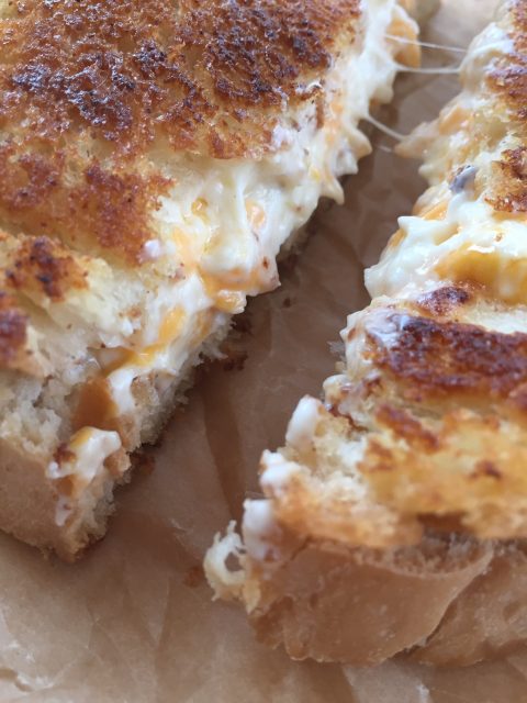 THE Grilled Cheese -- You'll just never eat one this good, I pretty much promise. Loaded with fresh garlic and a cheesy filling that's just too good to be true. | thatwhichnourishes.com