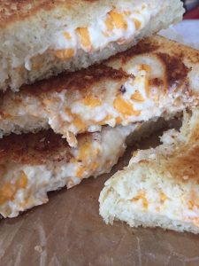 THE Grilled Cheese -- You'll just never eat one this good, I pretty much promise. Loaded with fresh garlic and a cheesy filling that's just too good to be true. | thatwhichnourishes.com