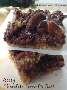 Gooey Chocolate Pecan Pie Bars -- Pecan pie, step back! There's a yummier version in town! All of the decadent goodness of pecan pie with the BONUS of gooey melted chocolate. Super rich, super yummy. | thatwhichnourishes.com