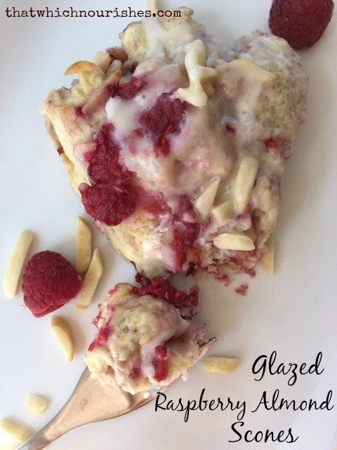 Glazed Raspberry Almond Scones -- soft, moist, buttery scones studded with fresh raspberries and blanketed in a sugary glaze | thatwhichnourishes.com