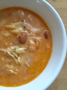Cheesy White Chili -- Cheesy, rich, slightly spicy bowl of white chili. Loaded with white beans, chili, and pepper jack cheese, this is how you do winter comfort food! | thatwhichnourishes.com