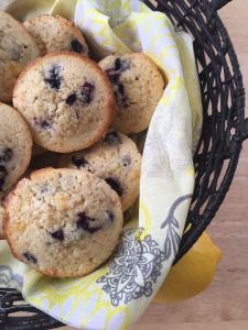 Lemon Blueberry Muffins -- If Lemon Bars and blueberry muffins had a baby, this would surely be it. Super moist muffins packed with tart lemon flavor. | thatwhichnourishes.com | thatwhichnourishes.com