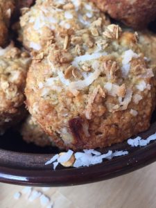 Tropical Crunch Muffins -- Packed with bananas, coconut, and a crunchy granola surprise, these moist and tender muffins are exactly the little escape and ordinary day needs. | thatwhichnourishes.com