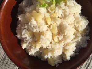 Pineapple Coconut Rice -- Creamy, coconut-y rice with hints of sweetness from pineapple. This easy rice makes a perfect and unique side dish ideal with chicken, fish, or pork. | thatwhichnourishes.com