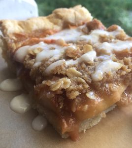 Caramel Apple Crisp Pie -- If Apple Crisp and Apple Pie had a baby and you smothered it with caramel or glaze, this would be the yummy baby. A tender flaky crust holds apple pie at its cinnamon finest and then is covered with apple crisp topping and drizzled with caramel or a powdered sugar glaze. | thatwhichnourishes.com