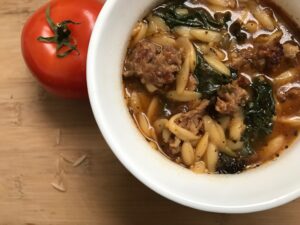 Sausage Orzo Soup -- Filled with sausage, kale, and orzo pasta, this savory soup has a punch of flavor and heartiness in a quick and simple soup that can be ready in under an hour. | thatwhichnourishes.com
