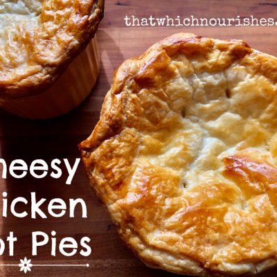 Cheesy Chicken Pot Pie -- Tender chunks of turkey or chicken and the veggies of your choice basking in a cheesy, rich and savory sauce, topped with buttery puff pastry and baked to pot pie perfection in less than an hour! | thatwhichnourishes.com