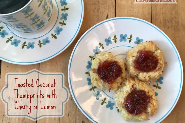 Coconut Thumbprint Cookies with Cherry or Lemon -- Buttery shortbread cookies are covered in coconut and filled with tart jam or homemade lemon curd for a rich cookie in a beautiful little bundle of yum. | thatwhichnourishes.com