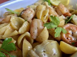 One Skillet Shrimp and Artichoke Pasta -- Shrimp, artichokes, Parmesan, and lemon combine to make a quick, easy meal with clean-up a snap as everything comes together in one scrumptious skillet ready in less than 20 minutes. | thatwhichnourishes.com