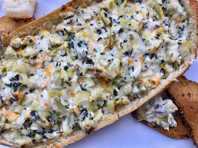Four Spinach Artichoke Dip -- Four cheeses combine perfectly with garlic, spinach, and artichokes to create the very best version of this classic dip we all love. Bake it in a bread bowl for ultimate dipping pleasure. | thatwhichnourishes.com