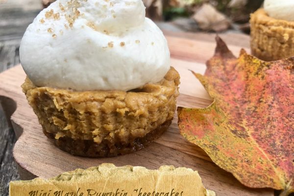 Mini Maple Pumpkin Cheesecakes -- Perfect little creamy maple pumpkin cheesecakes full of all the spices of fall layered over a ginger snap crust and topped with a maple whipped cream. | thatwhichnourishes.com