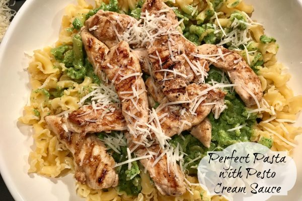 Perfect Pasta with Pesto Cream Sauce -- Grilled chicken, and freshly made pesto are tossed into pasta with a bit of butter and cream to make a fast and easy nourishing meal. | thatwhichnourishes.com