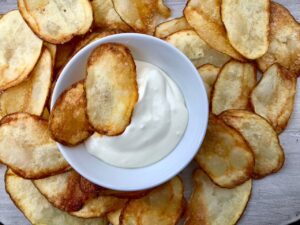 Homemade Potato Chips fried in coconut oil -- There's never been a better potato chip than the warm and salted one fresh from the fryer made in coconut oil. | thatwhichnourishes.com