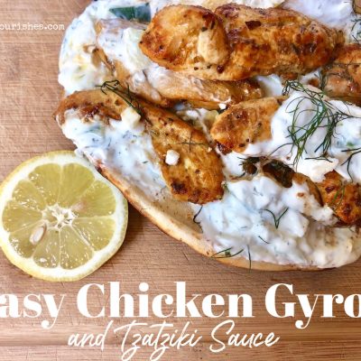 Easy Chicken Gyros and Tzatziki Sauce -- Marinated chicken piled on naan bread and blanketed with homemade tzatziki sauce loaded with garlic, dill, and cucumbers and then covered in rich feta. | thatwhichnourishes.com