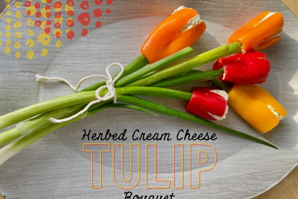 Herbed Cream Cheese Tulip Bouquet -- Peppers or cherry tomatoes stuffed with the perfect herbed cream cheese mixture are given green onion stems and transformed into a beautiful bouquet! | thatwhichnourishes.com